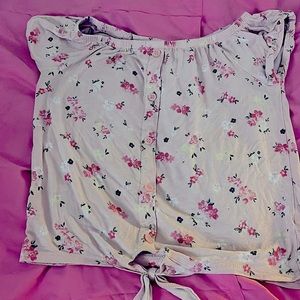 This is a pink floral button/tied short sleeve shirt for kids